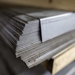 A stack of galvanized thick hot rolled steel sheets in a war
