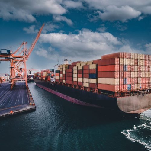 Aerial view of Container freight ship in transit